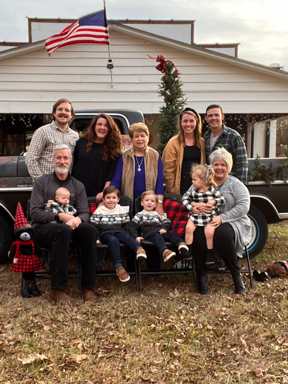 The Thompson extended family gathered in front of the general store at Christmas